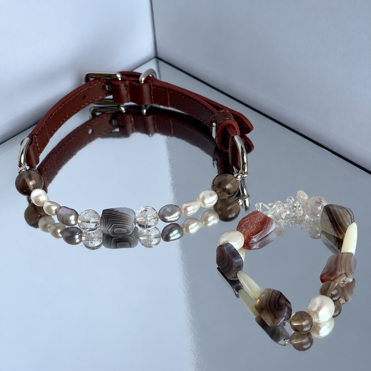 Close-up of the agate-look and crystal-style beads on the dark brown leather collar
