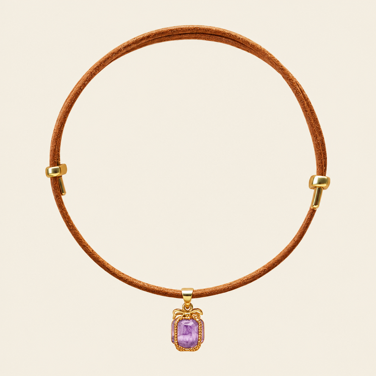 Purple amethyst pendant in a gold-tone frame on an adjustable tan leather cord