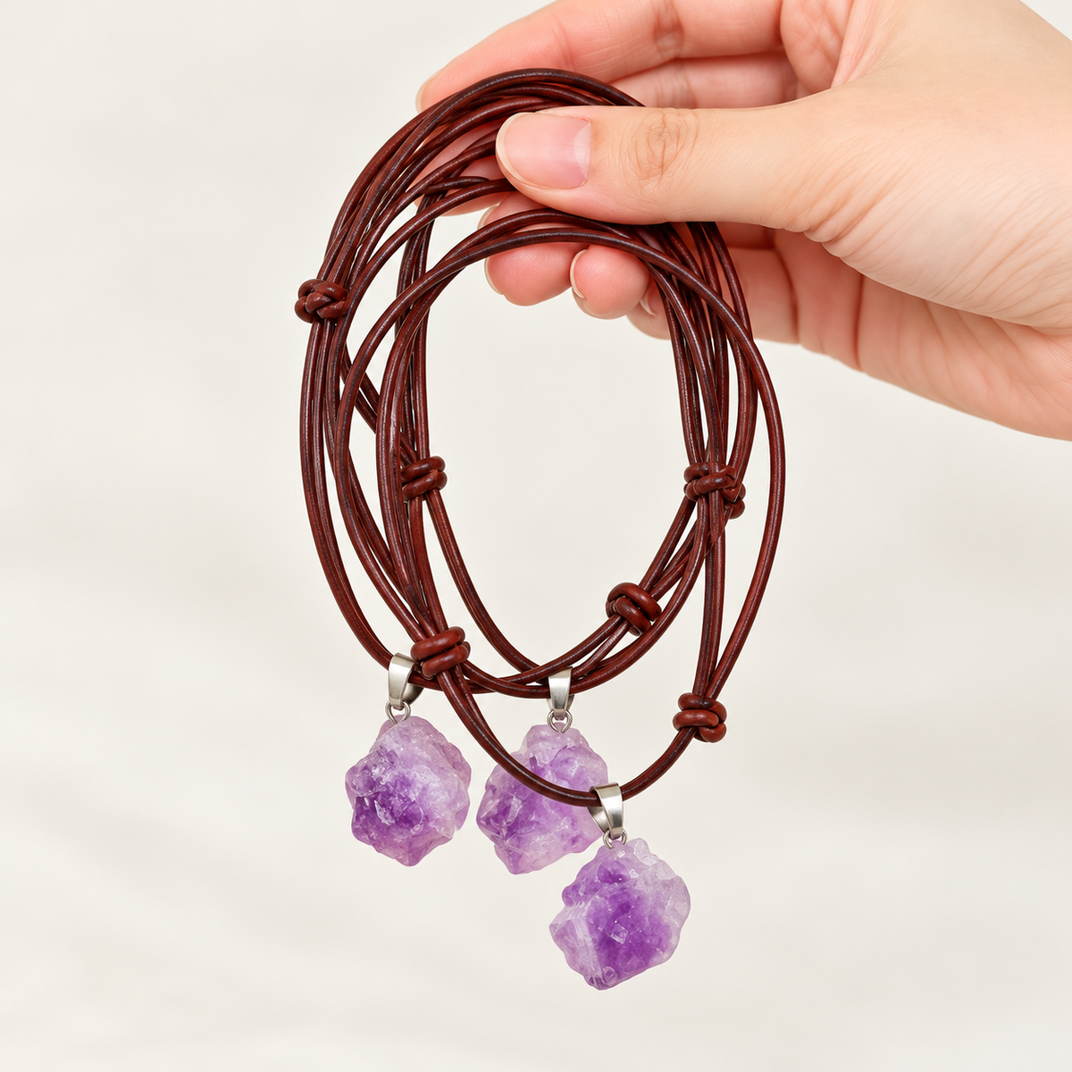 Examples of natural variations in raw amethyst pendants
