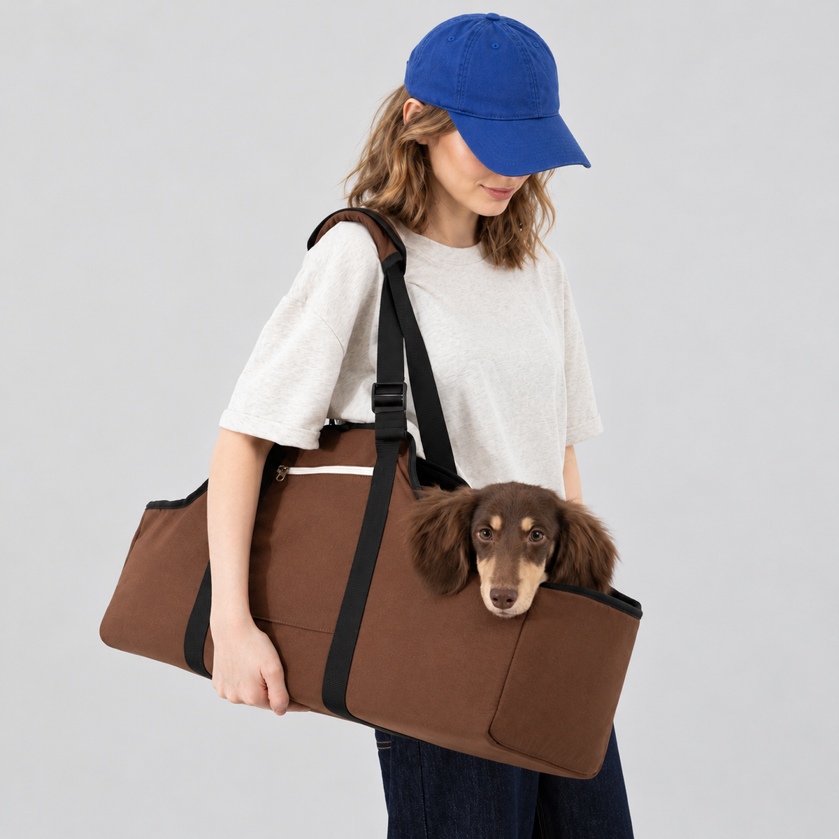 Brown carrier worn over one shoulder